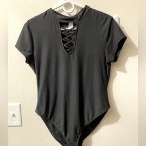 Black body suit with criss cross detail